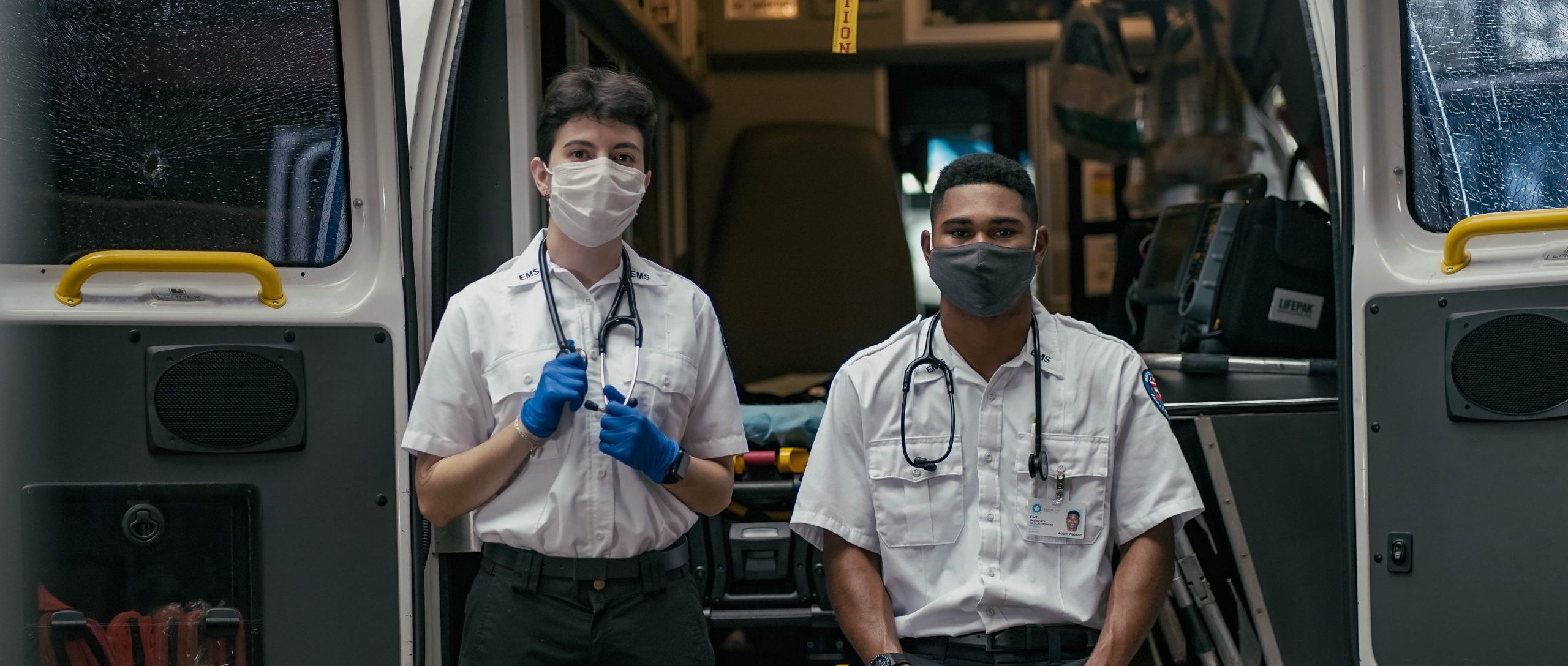 Students outside of an ambulance