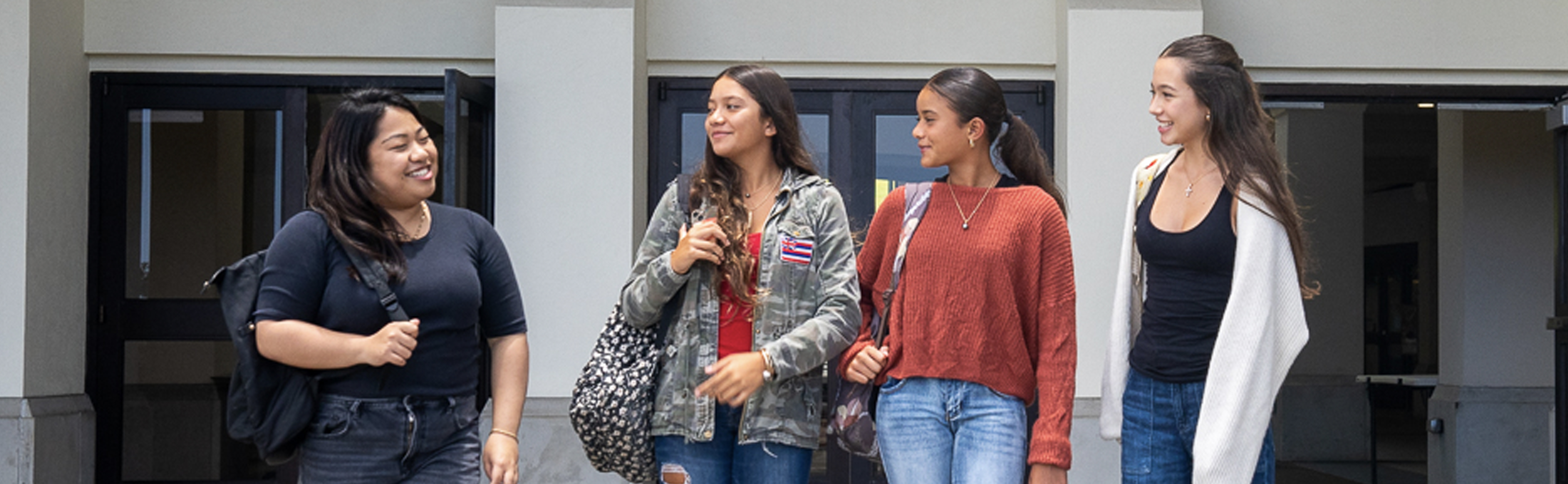 3 female students with an HCCN advisor